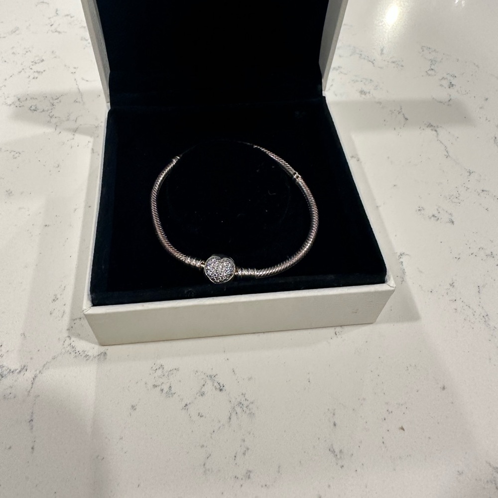 Brand new Pandora charm bracelet. Never worn!